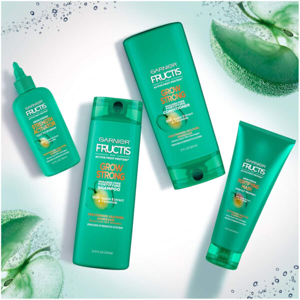 68931c0b2075d7757af792c2596ecfcbde8bafdaaac801193eba8.jpg Garnier Fructis Grow Strong Conditioner, 33.8 Fl Oz, 1 Count (Packaging May Vary)