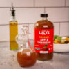 6893885c84aa67e7abc4773b8fef45a008d01dda6d6229679b6f6.jpg Lucy's Family Owned - 34oz. GLASS BOTTLE (2 PACK) Organic, With the Mother, Apple Cider Vinegar, Unfiltered, Unpasteurized, Raw, and NonGMO